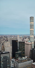 High angle view of buildings in city against sky