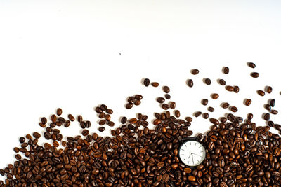 Close-up of coffee beans against white background