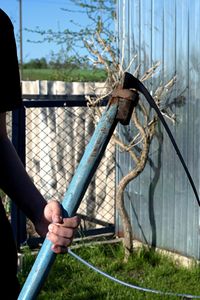 Person holding metal chain