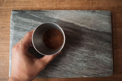 High angle view of coffee cup on table