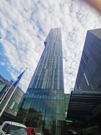 Low angle view of modern buildings against sky