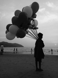 Rear view of people on beach