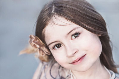 Close-up portrait of cute girl smiling