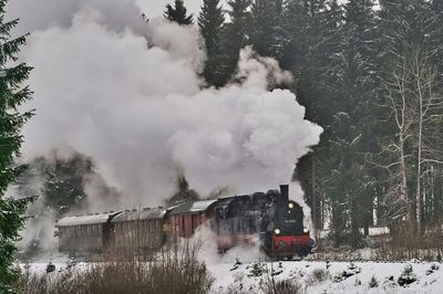 Smoke emitting from train during winter