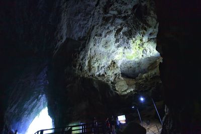 Low angle view of large rock formation at night