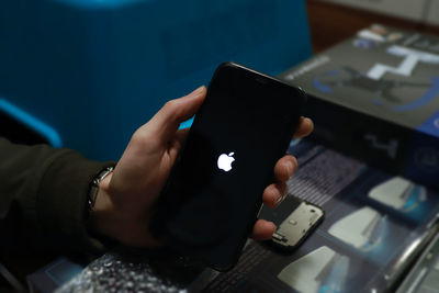 Midsection of man using mobile phone