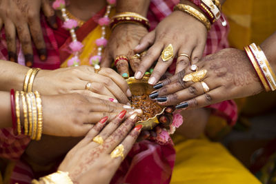 Cropped image of women during wedding ceremony