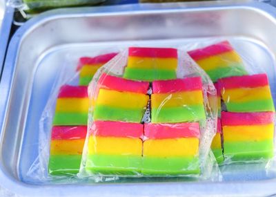 High angle view of multi colored candies in container