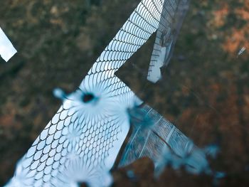 Close-up of umbrella on metal