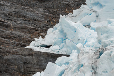 Close-up of ice against rock