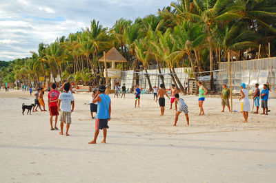 Group of people playing on beach