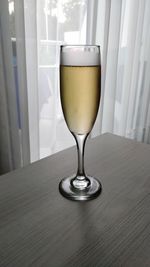Close-up of champagne in glass on table