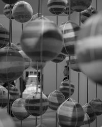Low angle view of decorations hanging from glass window