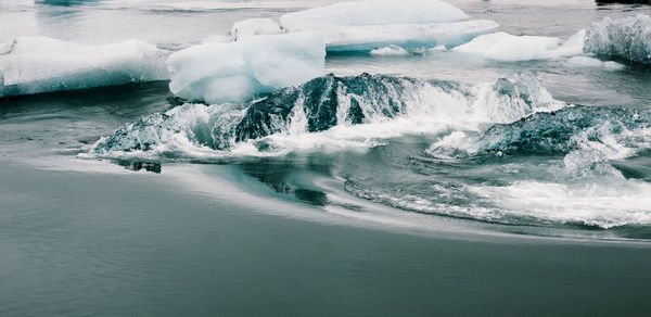 Icebergs in frozen sea 