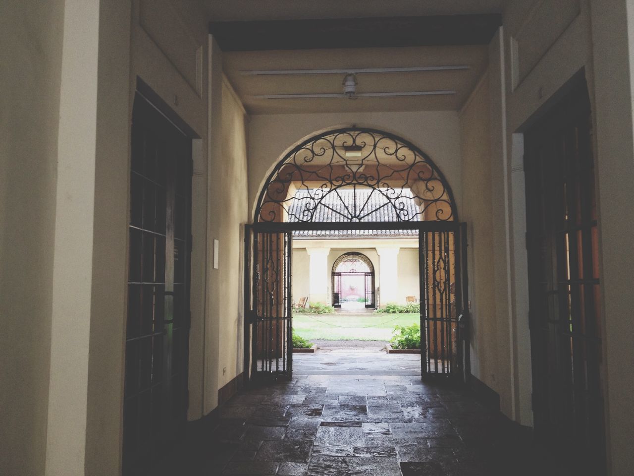 arch, architecture, built structure, the way forward, entrance, building exterior, archway, door, indoors, diminishing perspective, gate, empty, window, day, arched, walkway, corridor, building, cobblestone, no people