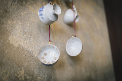 Low angle view of light bulbs hanging on ceiling