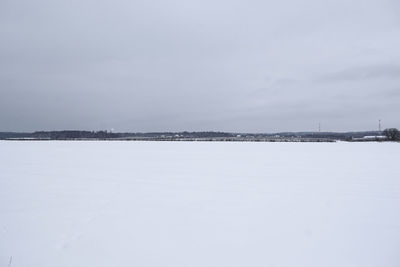 Scenic view of frozen lake against sky