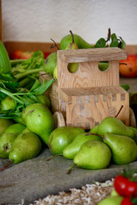 Close-up of apples in basket on table