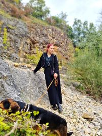 Full length of woman standing on rock