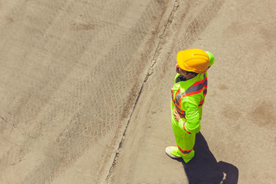 High angle view of man walking on beach