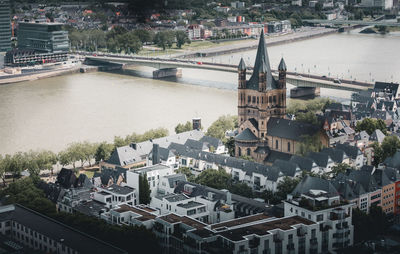 High angle view of bridge over river amidst buildings in city