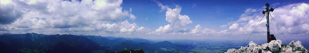 Scenic view of mountains against cloudy sky