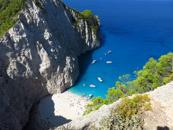 High angle view of boats at beach during sunny day