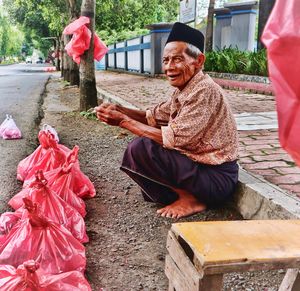 Full length of man sitting at temple