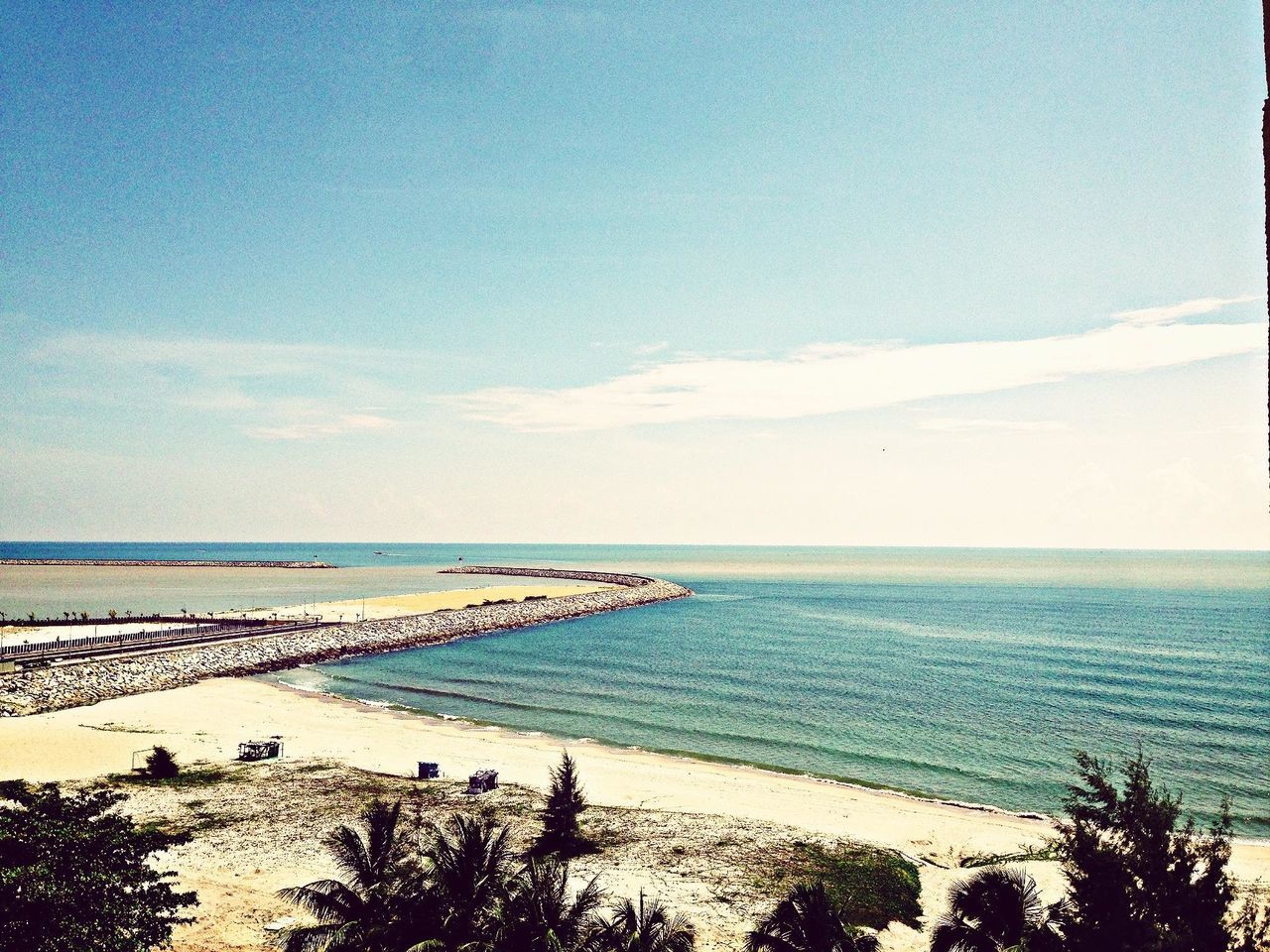 sea, horizon over water, water, beach, tranquil scene, scenics, tranquility, beauty in nature, sky, shore, nature, idyllic, coastline, blue, sand, tree, seascape, outdoors, incidental people, remote