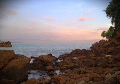 Scenic view of sea against sky at sunset