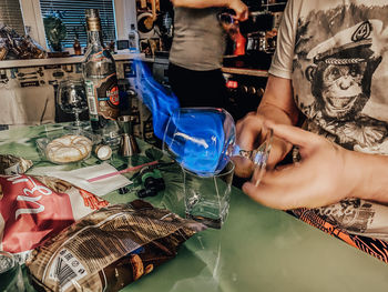 Midsection of woman holding umbrella