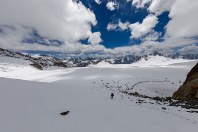 Scenic view of snow covered mountains against sky