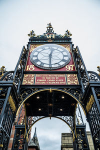 Low angle view of clock tower against sky