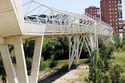 View of bridge in city against sky