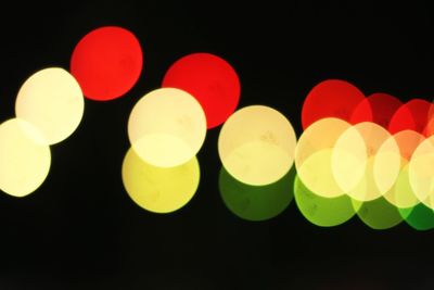 Defocused image of illuminated lights at night