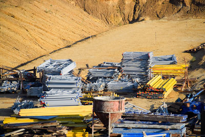 High angle view of abandoned stack on field