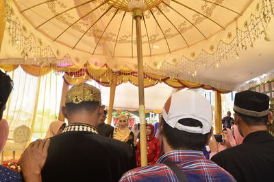 Rear view of people at amusement park