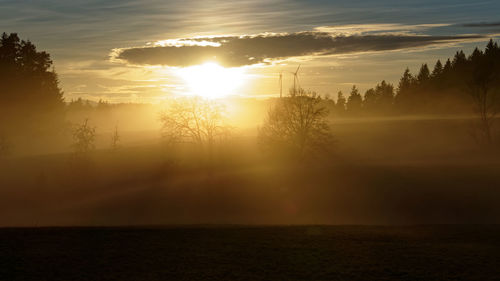 Scenic view of silhouette landscape against sky during sunset