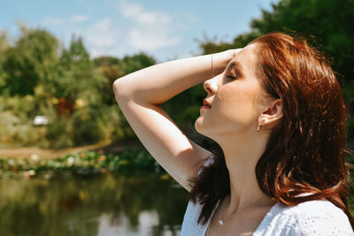 Side view of young woman looking away