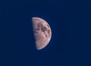 Low angle view of moon against sky at night