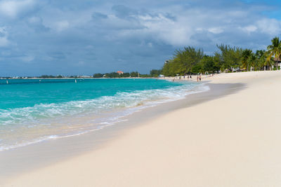 View of beach against cloudy sky