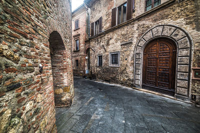 Alley amidst buildings in city