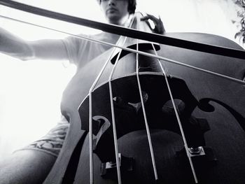 Close-up of man playing guitar