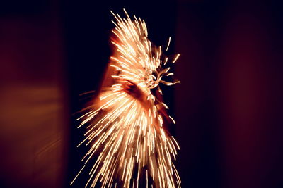 Close-up of firework display at night