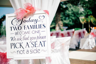 Close-up of information sign at wedding ceremony