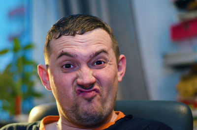 Close-up portrait of man making a face