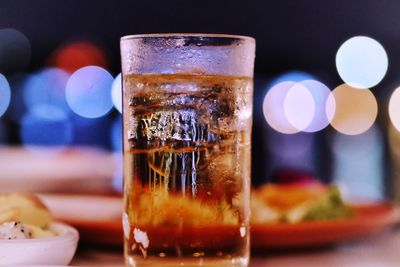 Close-up of beer glass on table