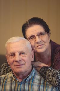 Portrait of smiling senior couple at home