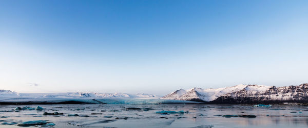 Scenic view of frozen sea against sky