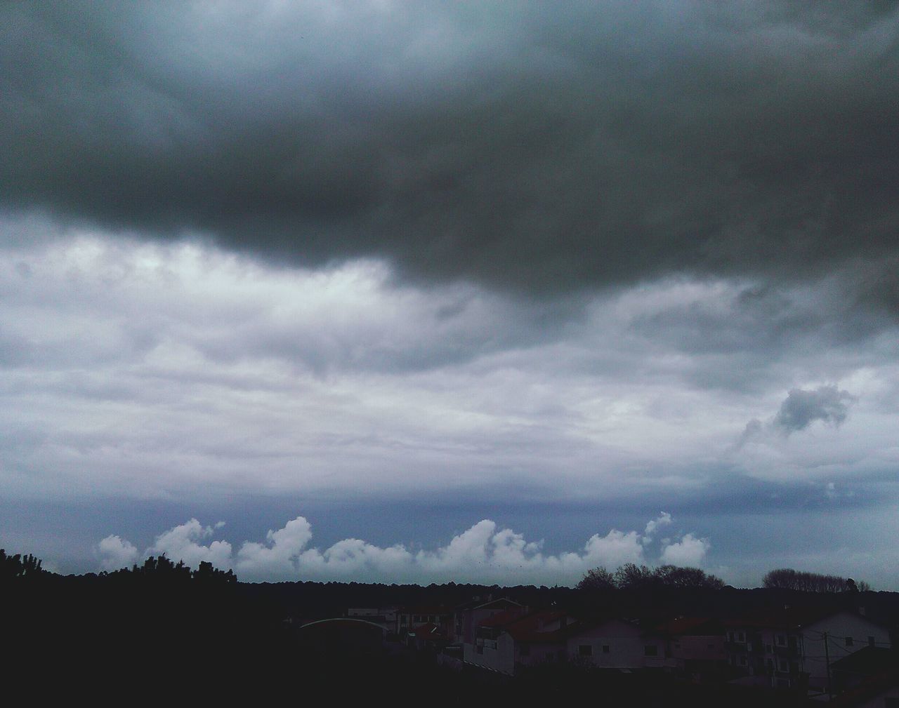 sky, cloud - sky, cloudy, weather, overcast, scenics, landscape, tranquil scene, beauty in nature, tranquility, storm cloud, nature, cloud, dusk, silhouette, cloudscape, mountain, dramatic sky, outdoors, built structure